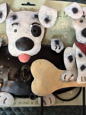 Two handcrafted, metal, dog-themed wall accents. Made in Indonesia.
